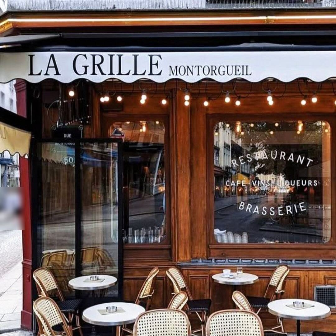 La Grille Montorgueil's wooden shopfront and terrace on rue Montorgueil